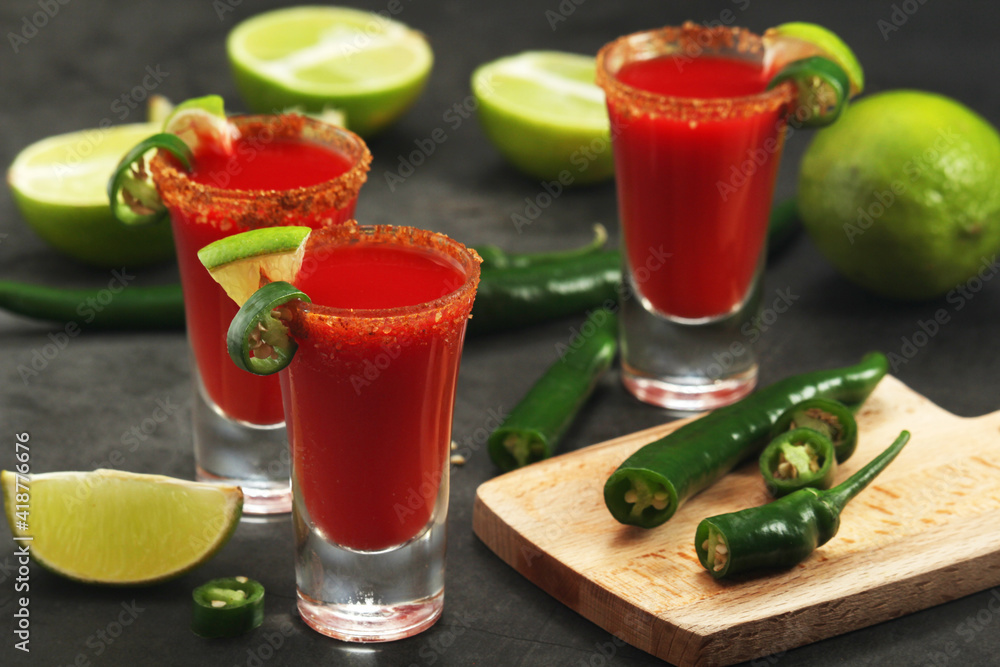 Shots with sangrita - traditional Mexican cocktail Shots with sangrita - traditional Mexican cocktail