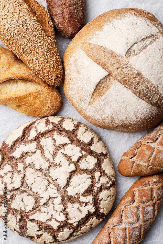 Naklejka premium Fresh bread and baguette. Bakery Products