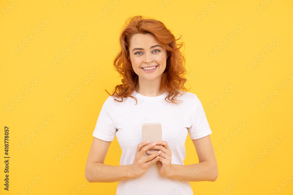 happy redhead woman working online. mobile chat app. girl chat online. sms and instant messaging happy redhead woman working online. mobile chat app. girl chat online. sms and instant messaging