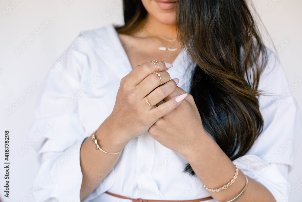 Woman modeling dainty, elegant, fine jewelry Woman modeling dainty, elegant, fine jewelry
