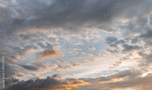 Photography Evening sky with some yellow, white, grey and dark clouds