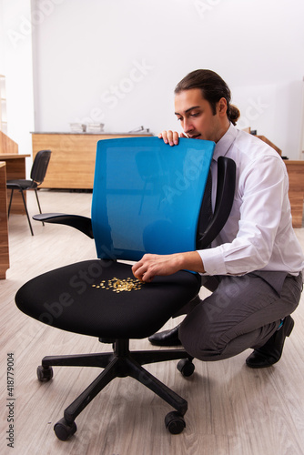 Ofice prank with sharp thumbtacks on chair photo