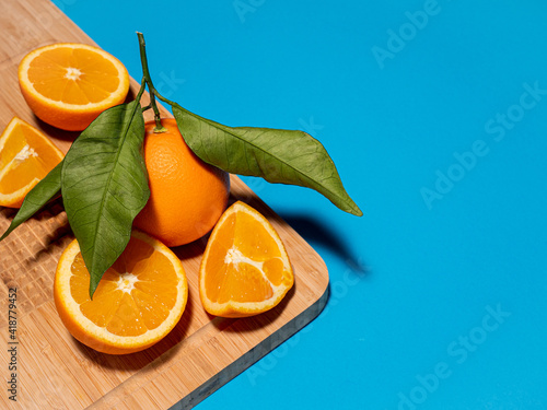 Orange fruit isolated on a monochromatic background.