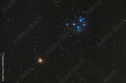 The red planet Mars and the Pleiades in the constellation Taurus, photographed on March 6th, 2021. photo