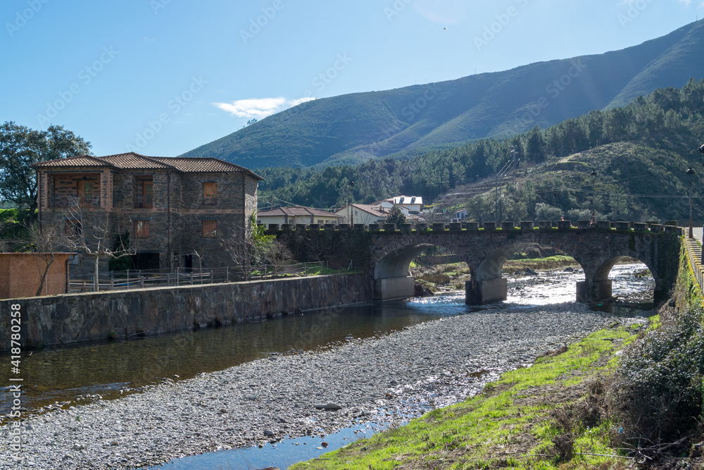 Fototapeta premium Views and landscape of the river and houses of the town of Nuñomoral.