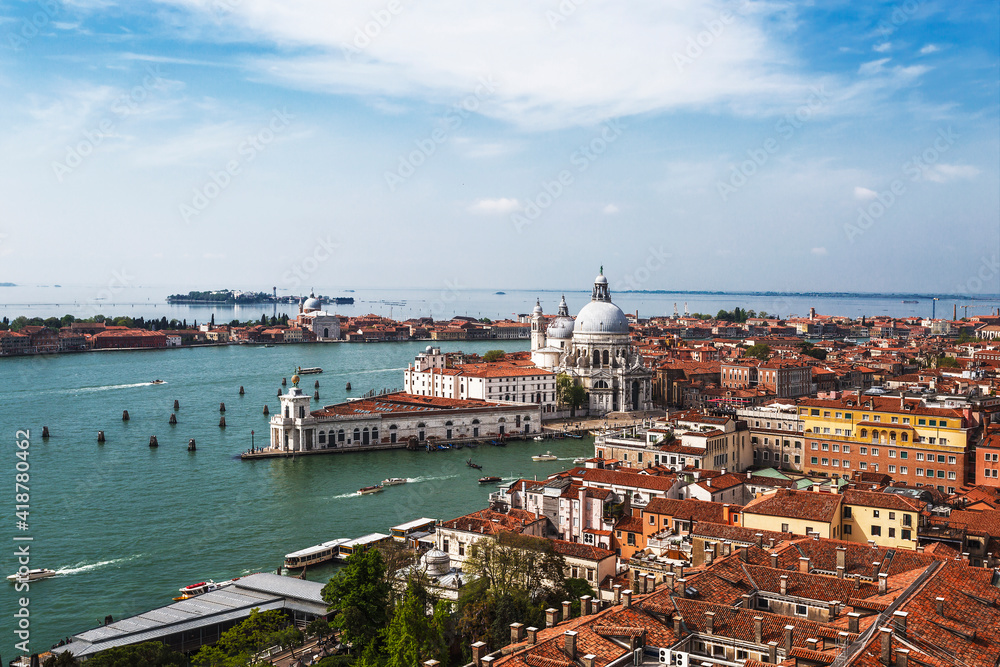 Top view of the city blocks of Venice, the Grand Canal, the Venetian Lagoon, the Cathedral of Santa Maria della Salute and the Cathedral of San Giorgio Maggiore. Venice, Italy