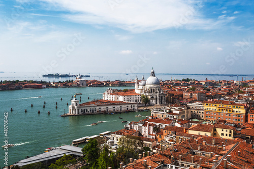 Top view of the city blocks of Venice, the Grand Canal, the Venetian Lagoon, the Cathedral of Santa Maria della Salute and the Cathedral of San Giorgio Maggiore. Venice, Italy © vesta48