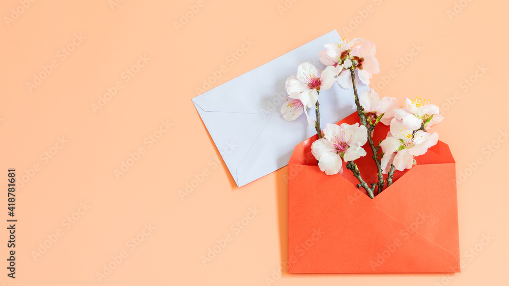 Spring mock up template with card blank and blooming almond branch in red envelope. Nice design for greeting, displaying your text, more design, or other purposes.