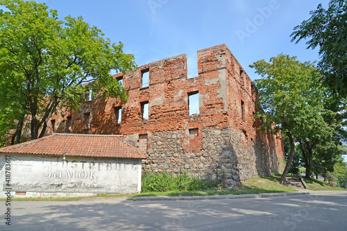 CHERNYAKHOVSK, RUSSIA - AUGUST 16, 2019: Ruins of Insterburg Castle (XIV century). Kaliningrad region. Russian text - lock photo