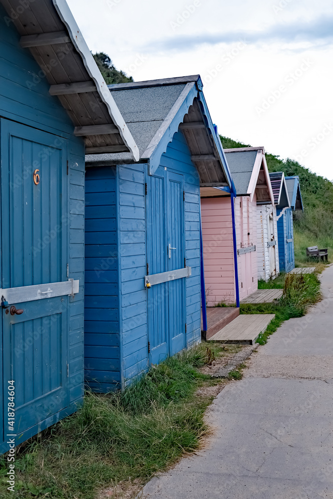 Fototapeta premium Traditional wooden beach huts on Cromer seafront on the North Norfolk Coast