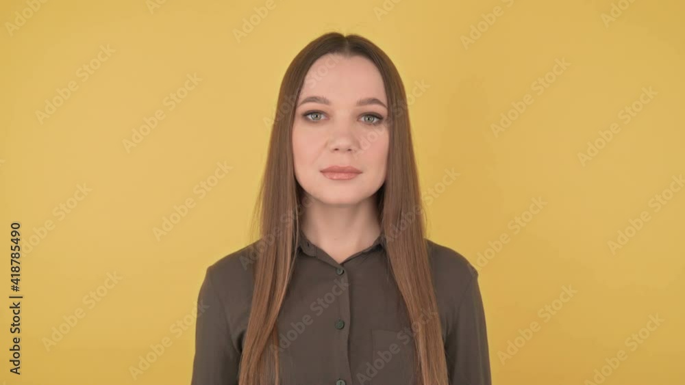 Close-up portrait of a young, business woman confidently looks into the chamber Close-up portrait of a young, business woman confidently looks into the chamber