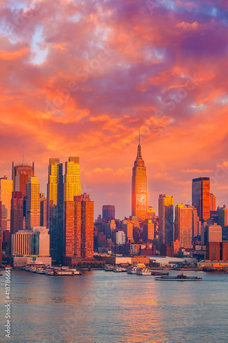 Manhattan skyline illuminated by sunset