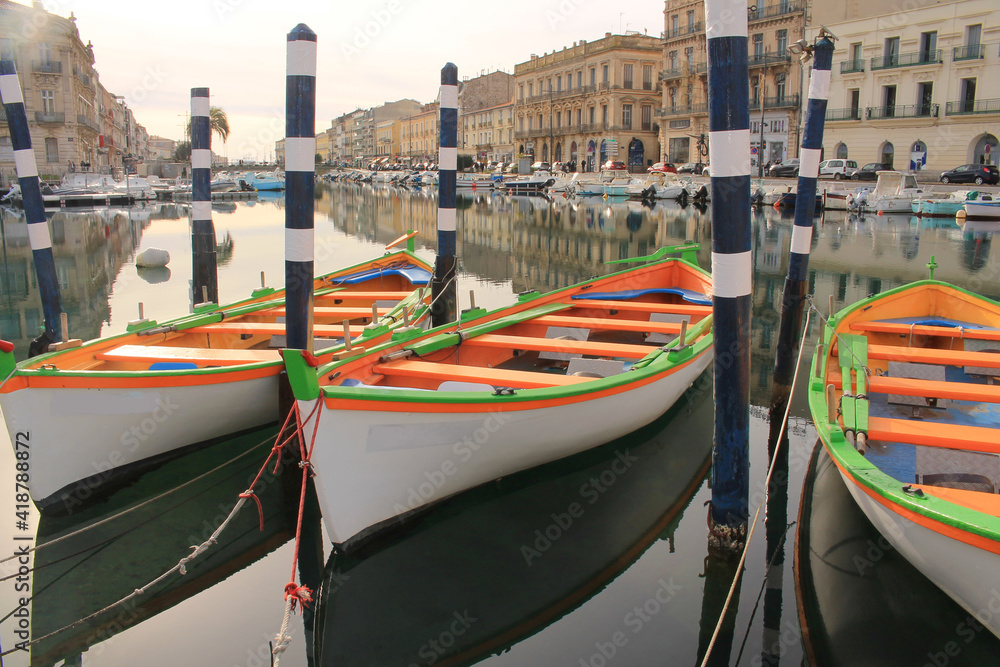 Colorful traditional wooden boats in Sete, a seaside resort and singular island in the Mediterranean sea, it is named the Venice of Languedoc Rousillon, France
