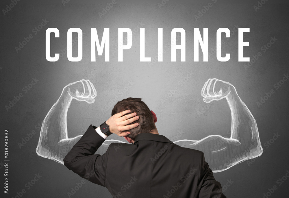 Rear view of a businessman with COMPLIANCE inscription, powerfull business concept Rear view of a businessman with COMPLIANCE inscription, powerfull business concept