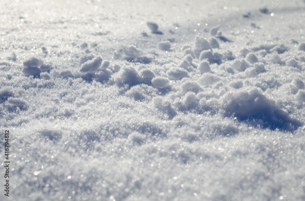 Large snowdrifts in a snowy meadow.