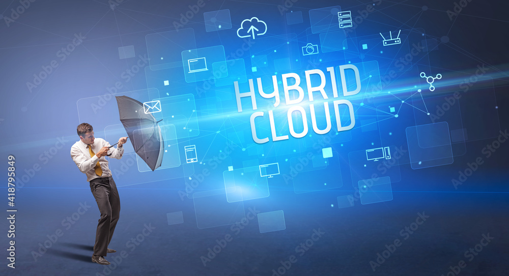 Businessman defending with umbrella from cyber attack and HYBRID CLOUD inscription, online security concept Businessman defending with umbrella from cyber attack and HYBRID CLOUD inscription, online security concept