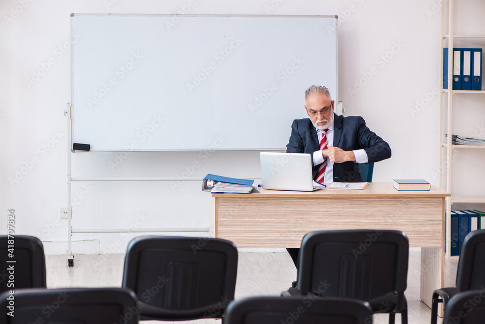 Old male business couch in the classroom during pandemic Old male business couch in the classroom during pandemic