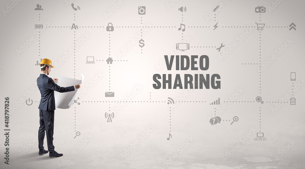 Engineer working on a new social media platform with VIDEO SHARING inscription concept Engineer working on a new social media platform with VIDEO SHARING inscription concept