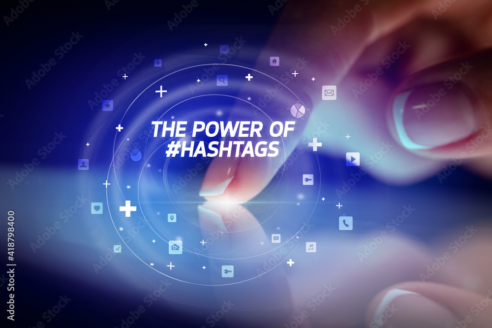 Finger touching tablet with social media icons and THE POWE OF #HASHTAGS