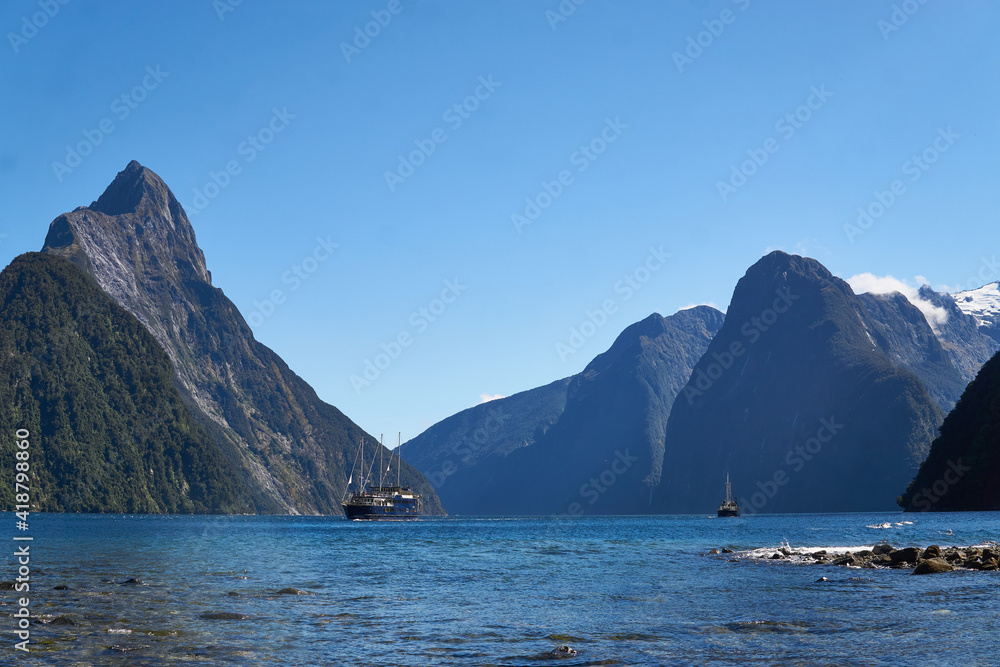 A view of Milford sound with the tourist boats, New Zealand A view of Milford sound with the tourist boats, New Zealand