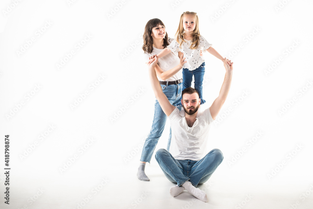 Young family have fun with small daughter isolated on white background