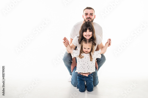 Young father and mother have fun with daughther isolated on white background photo