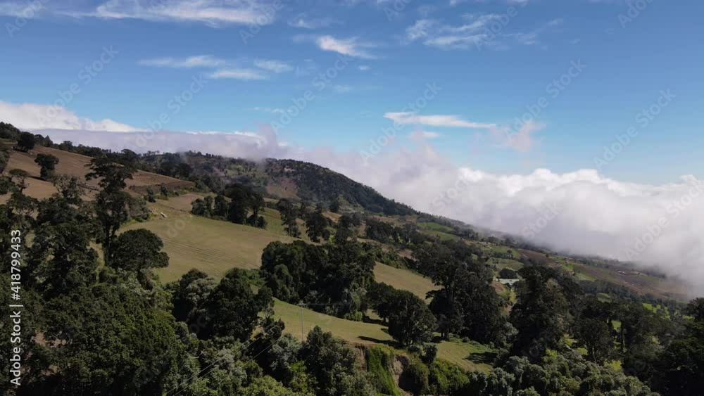 Irazu national park full of high altitude trees aerial shot clouds sunny day Costa Rica Irazu national park full of high altitude trees aerial shot clouds sunny day Costa Rica