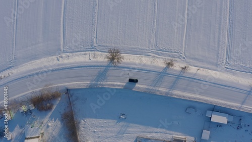 winter road top view. long turn a smooth turn on a slippery snowy road. dangerous road icy. aerial view 