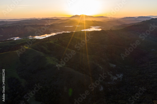A brilliant sunrise greets the hills of the East Bay, not far from San Francisco Bay in California.