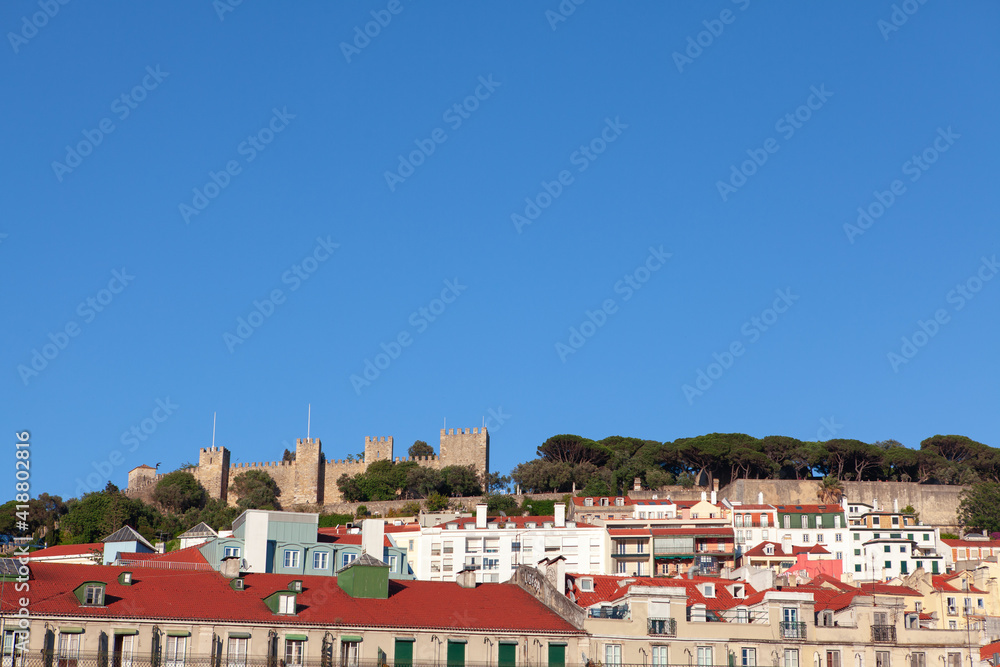 View of old town and  hilltop castle in Lisbon . Castelo de S. Jorge situated on the mountain top in Lisboa Portugal