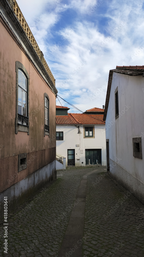 Fão, Esposende, Portugal - January 10, 2021: Located on the Cávado River’s left bank, the typical village of Fao is characterized by a marked neighborhood spirit. The narrow Sao Tome Street.