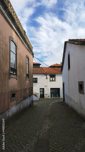 Fão, Esposende, Portugal - January 10, 2021: Located on the Cávado River’s left bank, the typical village of Fao is characterized by a marked neighborhood spirit. The narrow Sao Tome Street.