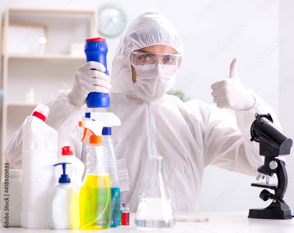 Chemist checking the quality of bathroom supplies Chemist checking the quality of bathroom supplies