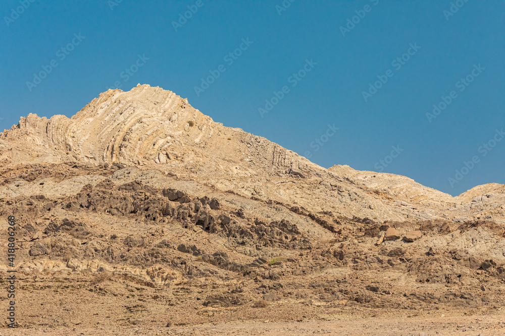 Folded sedimentary rock in a mountain in Oman.