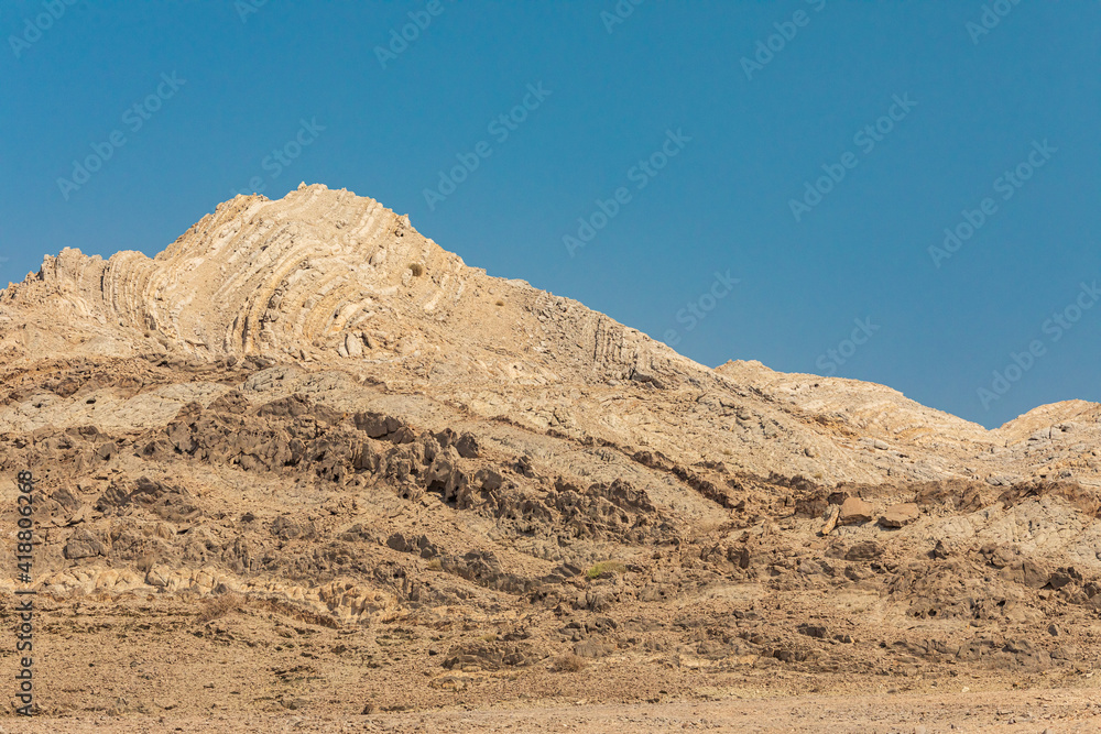 Folded sedimentary rock in a mountain in Oman. Folded sedimentary rock in a mountain in Oman.