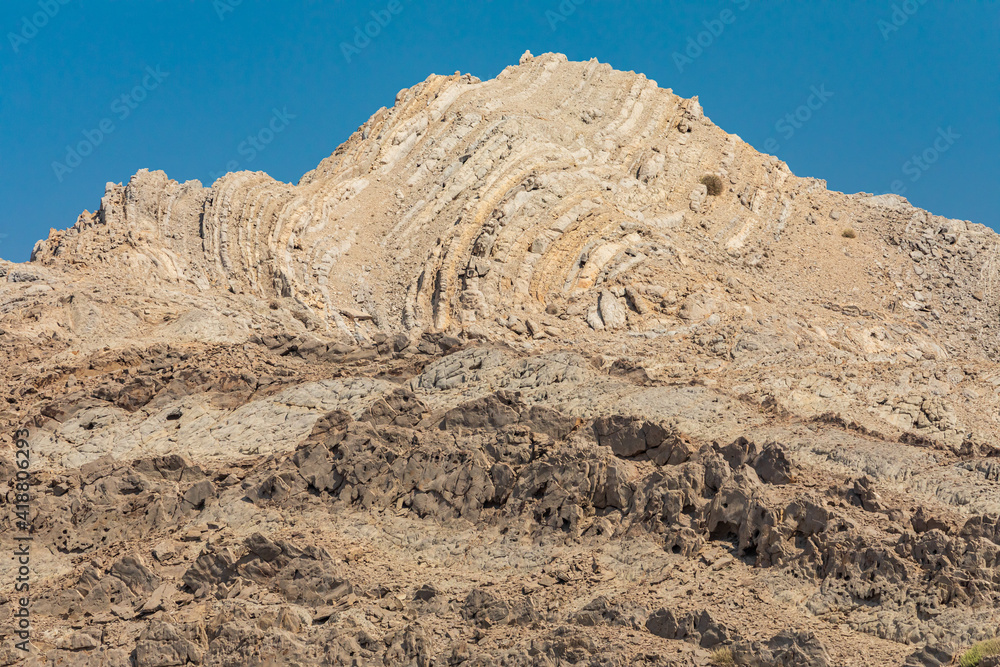 Folded sedimentary rock in a mountain in Oman.