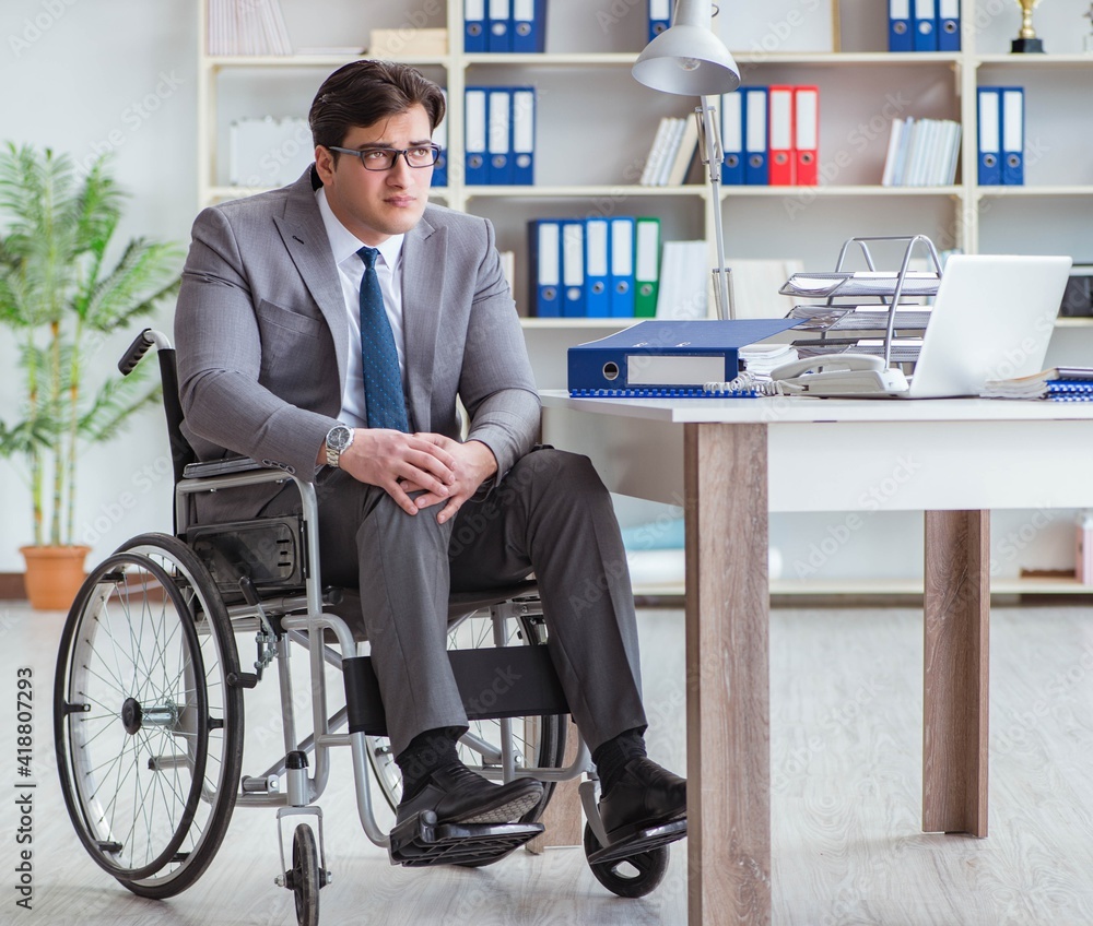 Disabled businessman working in the office Disabled businessman working in the office