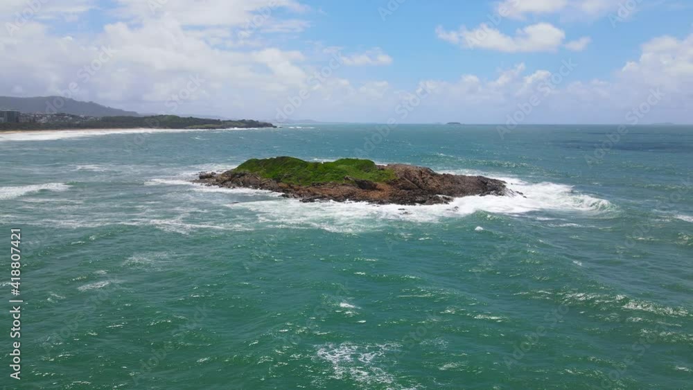 Aerial View Of Little Muttonbird Island Surrounded With Blue Sea In Summer - Coffs Harbour, NSW, Australia. Aerial View Of Little Muttonbird Island Surrounded With Blue Sea In Summer - Coffs Harbour, NSW, Australia.