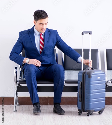 Man wairing to boarding in airport lounge room photo