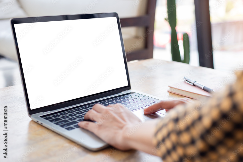 computer screen blank mockup.hand woman work using laptop with white background for advertising,contact business search information on desk at coffee shop.marketing and creative design computer screen blank mockup.hand woman work using laptop with white background for advertising,contact business search information on desk at coffee shop.marketing and creative design