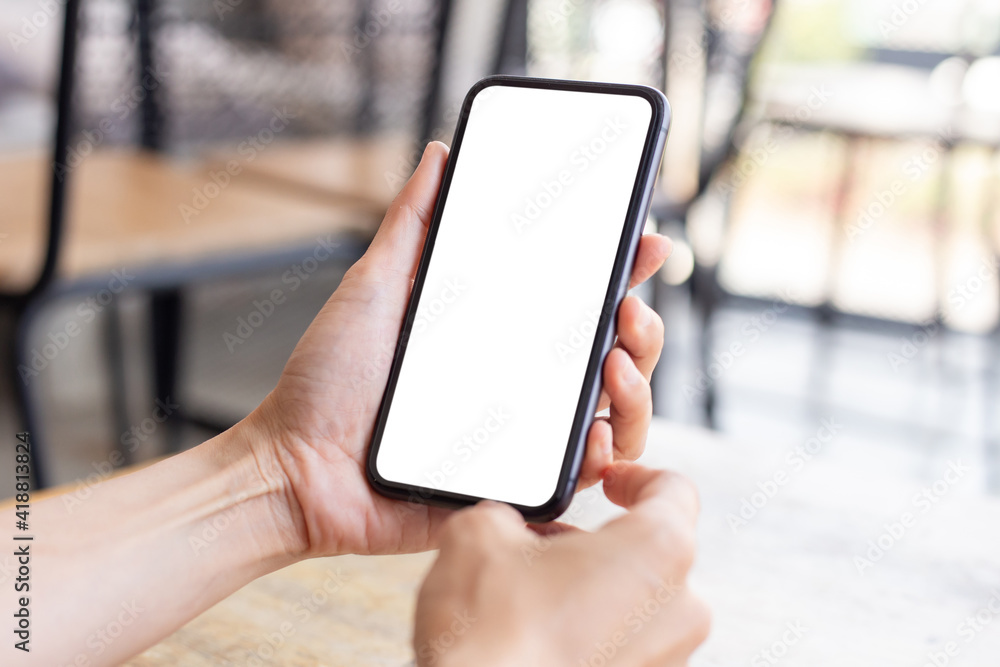 cell phone blank white screen mockup.woman hand holding texting using mobile on desk at office.background empty space for advertise.work people contact marketing business,technology cell phone blank white screen mockup.woman hand holding texting using mobile on desk at office.background empty space for advertise.work people contact marketing business,technology