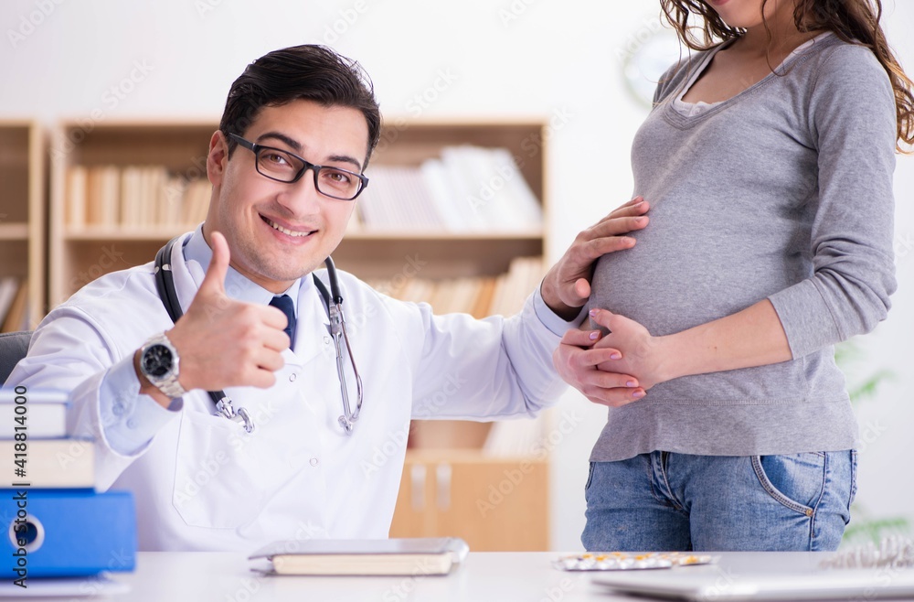 Fototapeta premium Pregnant woman visiting doctor for consultation
