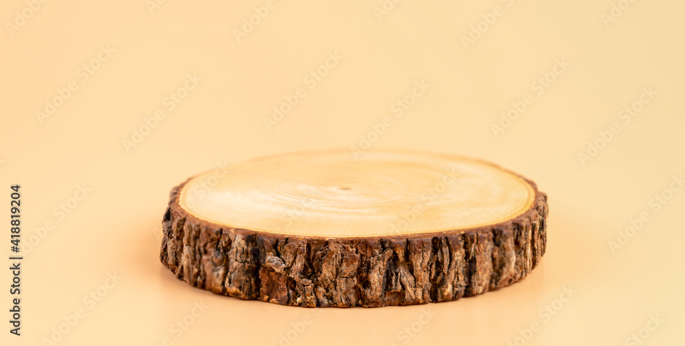 Wooden pedestal on orange background, show for cosmetic products, template for mockup. Wooden pedestal on orange background, show for cosmetic products, template for mockup.