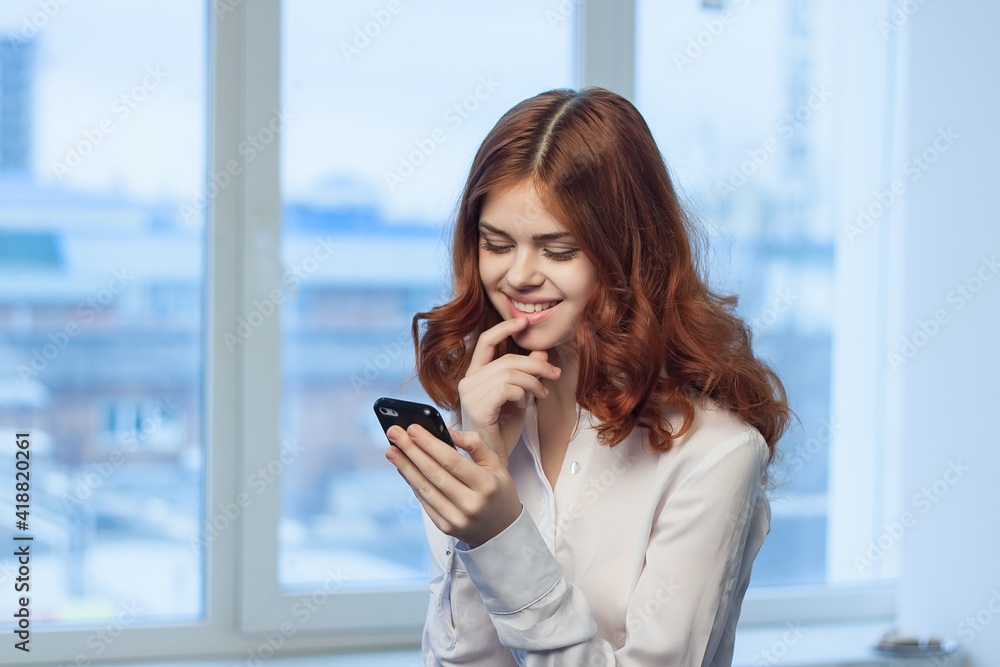 woman with phone in hands in office technology professional woman with phone in hands in office technology professional