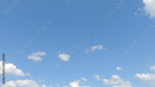 Slow Motion 4k cinemagraph b-roll TimeLapse, Beautiful sunny clear blue sky background with puffy fluffy white cloud n cumulus cloudscape in tropical summer n spring sunlight n sun ray at sunshine day