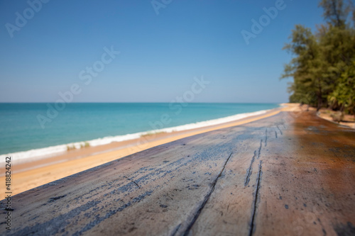 Fototapeta Naklejka Na Ścianę i Meble -  summer wood desk sky foreground and the sea of blue background on horizon tropical sandy beach. Feel relaxed with nature. Concept about resort, travel, nature, landscape, health