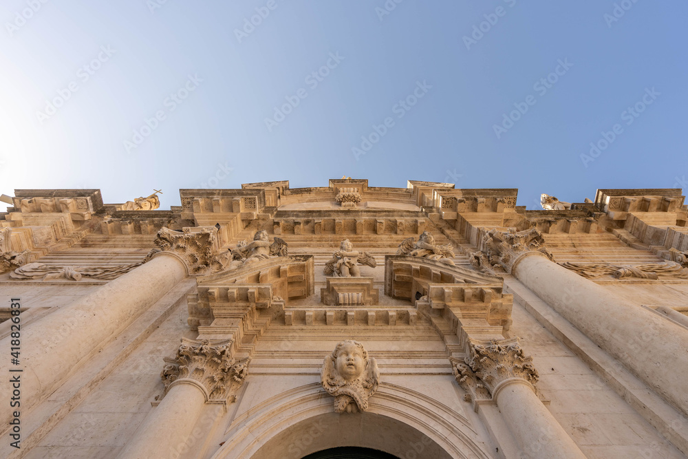 Upward view of St. Blaise church with angel decoration in old town Dubrovnik in Croatia summer morning