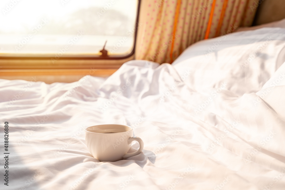 Cup of coffee in camper van and while road trip traveling on vacation in the morning Cup of coffee in camper van and while road trip traveling on vacation in the morning