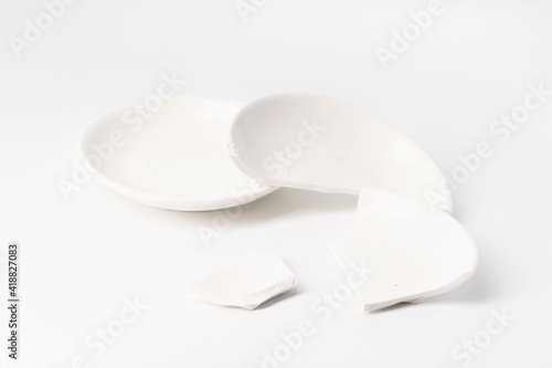 Broken ceramic plate on pure white background