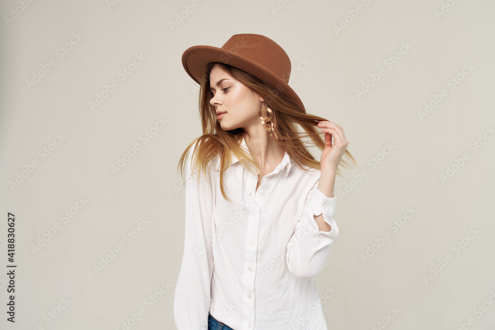 Pretty woman in hat white shirt elegant style fashion light background Pretty woman in hat white shirt elegant style fashion light background